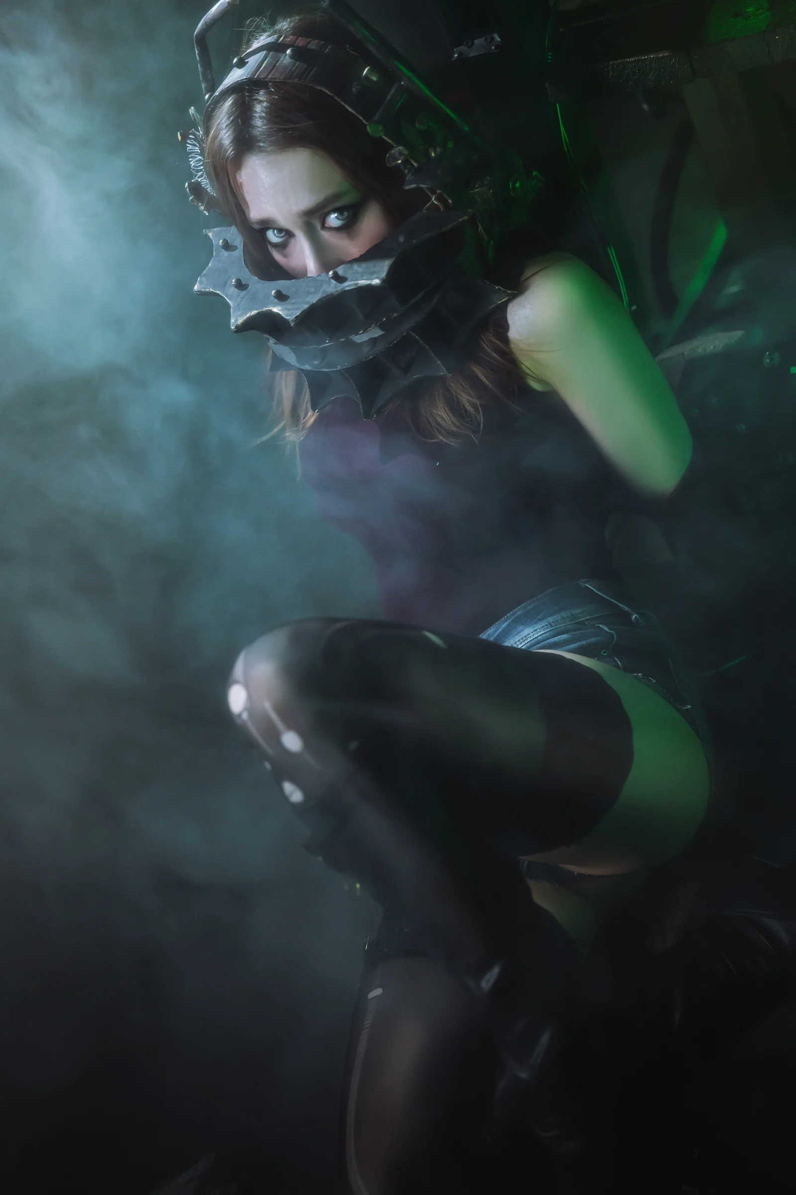 Dark fantasy portrait of Ira wearing a metal face mask under green light