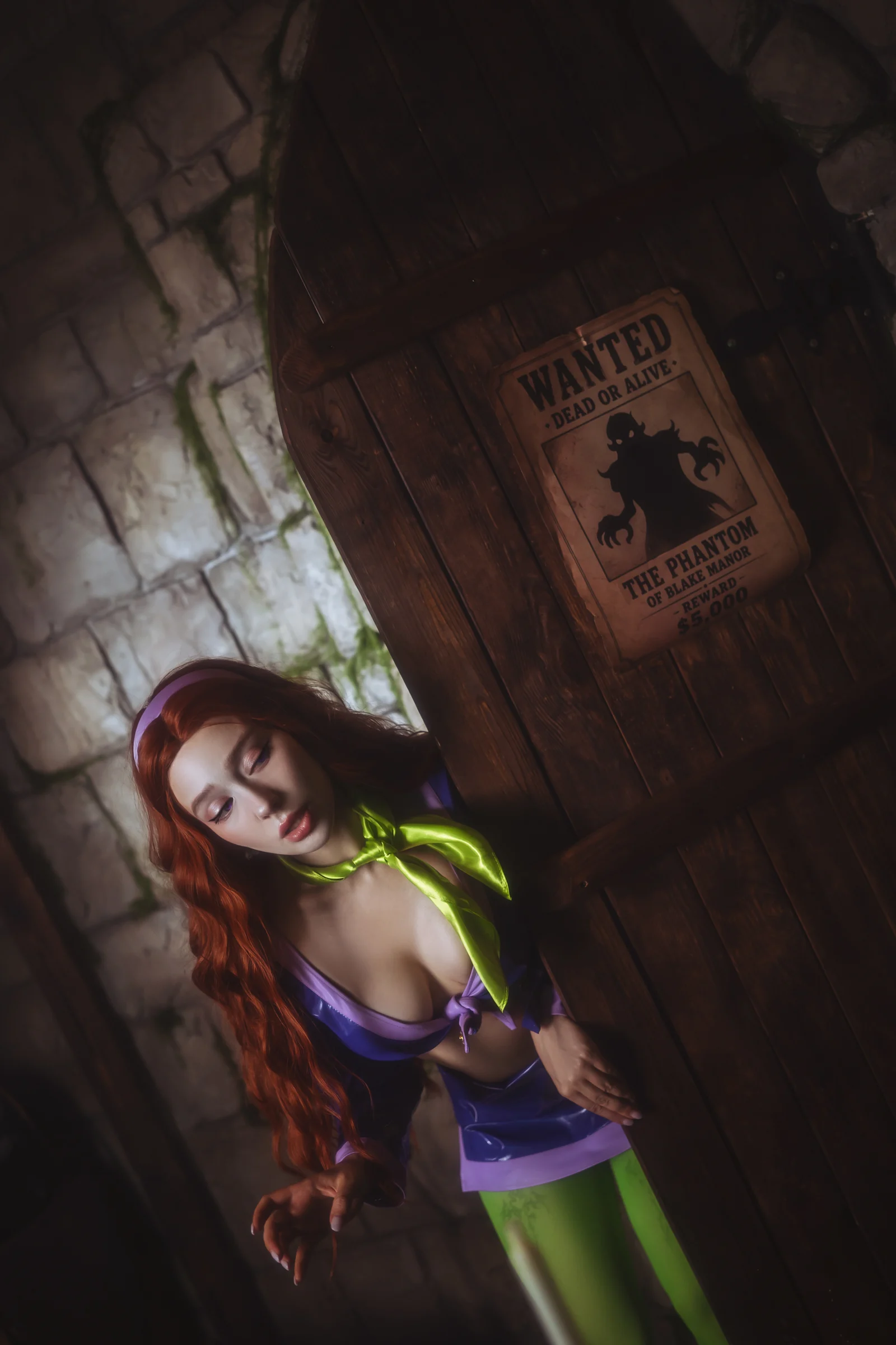 Ira as a mystery-solving character in purple and green beside a wanted poster