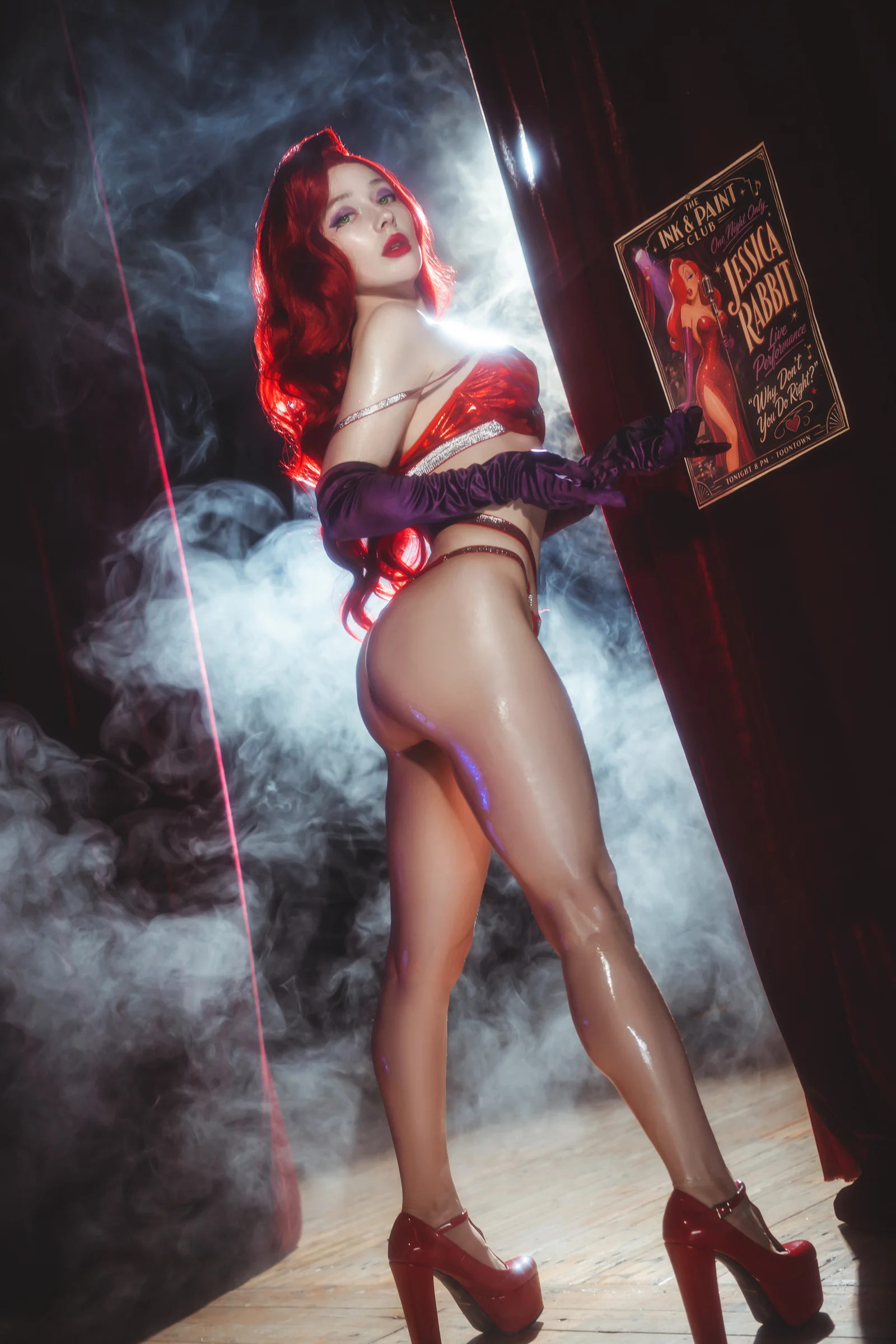 Ira in a red dress and long gloves in a vintage interior